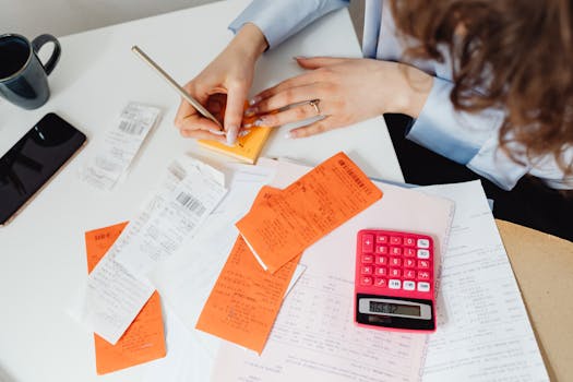 person organizing tax documents on a desk