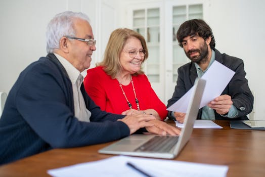 person reviewing mortgage and insurance documents on a laptop