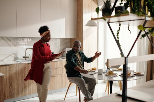 family discussing finances at a kitchen table