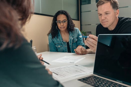 financial advisor discussing taxes with a couple