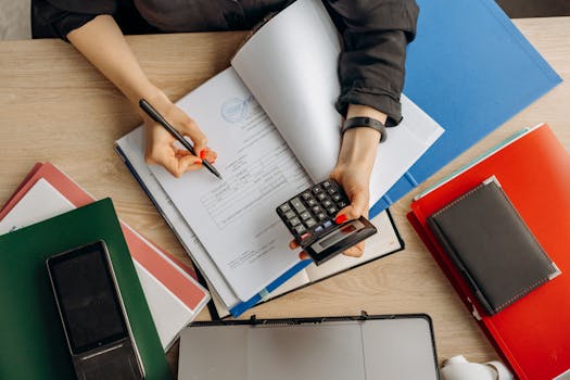 Tax documents and calculator on a desk