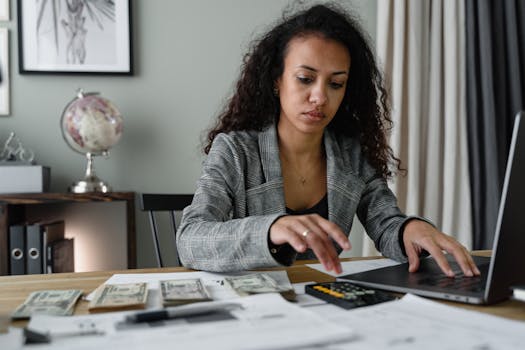mortgage documents and calculator on a desk